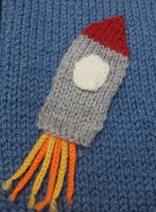 Handmade Knitted Rocket Sewn on Space Scene Fitting in Knitting Children Quick Craft Ideas