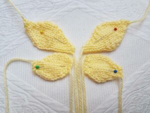 Handmade Knitted Butterly Wings laid out Fitting-in-Knitting