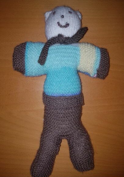 handmade children fitting in knitting character bear